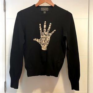 Black wool sweater with palm reading detail